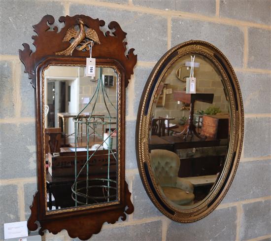 An oval painted and gilt-framed mirror and a mahogany wall mirror, larger width 57cm, height 83cm